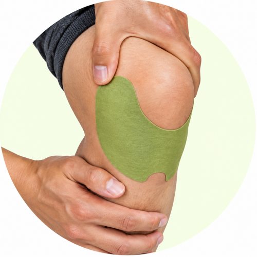 Pressing a herbal patch onto the knee